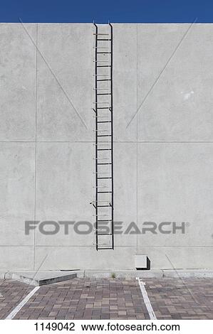 A ladder on the side of a building View Large Photo Image Stock Image - A ladder on the side of a building. Fotosearch