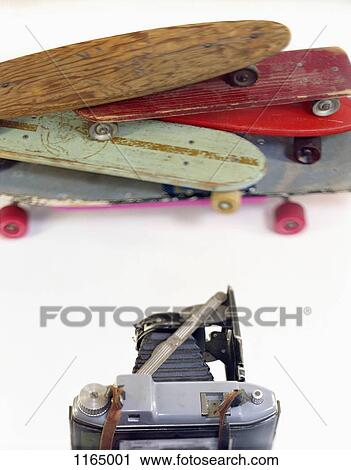 A large format camera and skateboards in a photo studio View Large Photo Image Stock Image - A large format camera and skateboards in a photo studio. Fotosearch