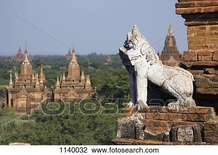 A lion statue on the corner of a temple in Bagan, Burma View Large Photo Image Stock Image - A lion statue on the corner of a temple in Bagan, Burma. Fotosearch