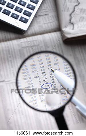 A magnifying glass magnifying a circled figure on a financial page View Large Photo Image Stock Image - A magnifying glass magnifying a circled figure on a financial page. Fotosearch