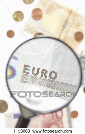 A magnifying glass magnifying a five Euro banknote View Large Photo Image Stock Image - A magnifying glass magnifying a five Euro banknote. Fotosearch