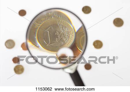 A magnifying glass magnifying a one Euro coin View Large Photo Image Stock Image - A magnifying glass magnifying a one Euro coin. Fotosearch
