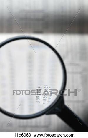 A magnifying glass magnifying stock market figure on a financial page View Large Photo Image Stock Image - A magnifying glass magnifying stock market figure on a financial page. Fotosearch