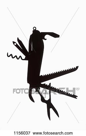 A multi-tool hanging in silhouette View Large Photo Image Stock Photo - A multi-tool hanging in silhouette. Fotosearch