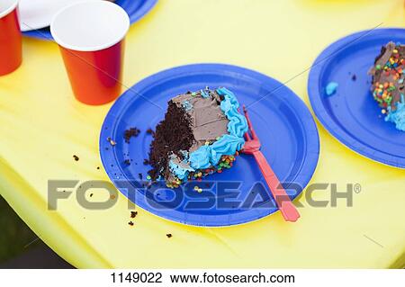 A piece of half eaten cake on a disposable plate View Large Photo Image Stock Image - A piece of half eaten cake on a disposable plate. Fotosearch