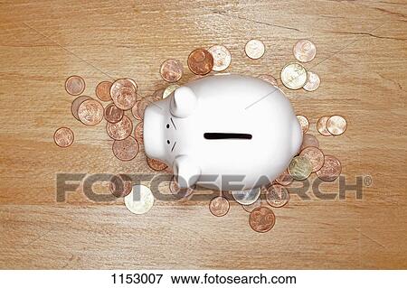 A piggy bank on top of a pile of various European Union coins View Large Photo Image Stock Photo - A piggy bank on top of a pile of various European Union coins. Fotosearch
