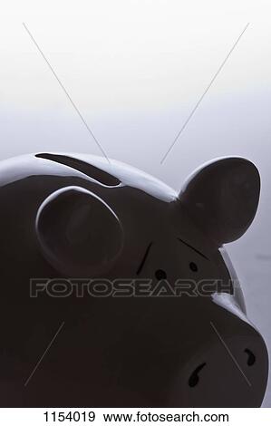 A piggy bank with raised eyebrows indicating worry View Large Photo Image Stock Photo - A piggy bank with raised eyebrows indicating worry. Fotosearch