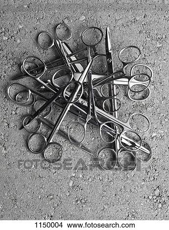 A pile of surgical scissors on cement View Large Photo Image Picture - A pile of surgical scissors on cement. Fotosearch
