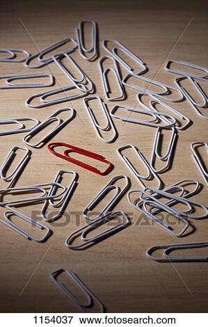 A red paperclip in the middle of a bunch white paperclips View Large Photo Image Stock Photo - A red paperclip in the middle of a bunch white paperclips. Fotosearch