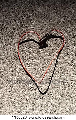 A red wire bent into the shape of heart View Large Photo Image Stock Photograph - A red wire bent into the shape of heart. Fotosearch