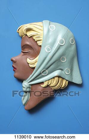 A retro wall hanging of a woman with blond hair and a headscarf View Large Photo Image Stock Image - A retro wall hanging of a woman with blond hair and a headscarf. Fotosearch