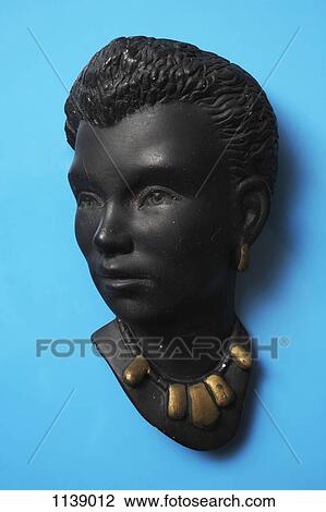 A retro wall hanging of a woman with short hair and a gold necklace View Large Photo Image Stock Image - A retro wall hanging of a woman with short hair and a gold necklace. Fotosearch