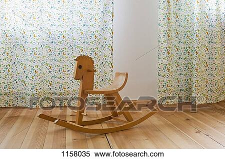 A rocking horse in a domestic room View Large Photo Image Stock Photography - A rocking horse in a domestic room. Fotosearch