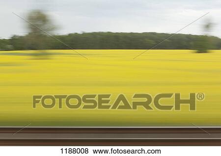 A rural landscape in blurred motion viewed from a moving train View Large Photo Image Stock Photo - A rural landscape in blurred motion viewed from a moving train. Fotosearch