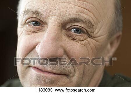 A senior man looking optimistic, close-up View Large Photo Image Stock Image - A senior man looking optimistic, close-up. Fotosearch