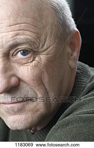 Stock Photo - A serious senior man, close-up. Fotosearch
