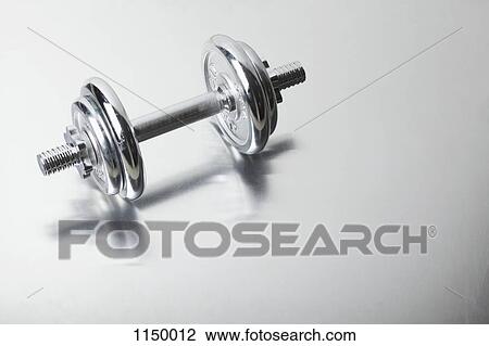 A shiny silver dumbbell View Large Photo Image Stock Image - A shiny silver dumbbell. Fotosearch