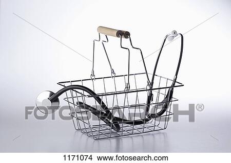 A shopping basket with a stethoscope in it View Large Photo Image Picture - A shopping basket with a stethoscope in it. Fotosearch