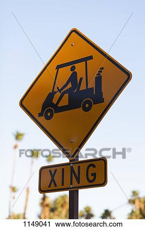 Stock Image - A sign for golf carts crossing. Fotosearch