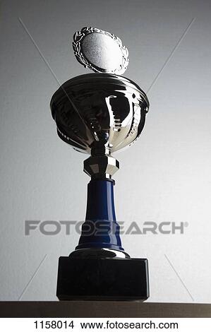A silver trophy with blank plaque surrounded by laurel wreath View Large Photo Image Picture - A silver trophy with blank plaque surrounded by laurel wreath. Fotosearch