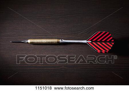 Stock Photo - A single dart lying on its side. Fotosearch