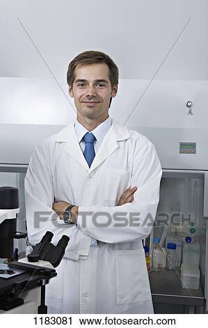 A smiling research technician standing in a research lab View Large Photo Image Stock Image - A smiling research technician standing in a research lab. Fotosearch