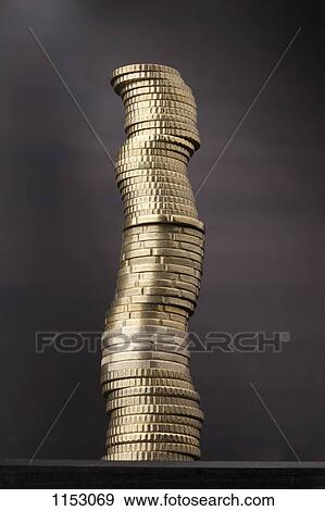 Stock Photo - A stack of various gold Euro coins. Fotosearch