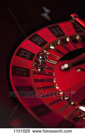 Stock Photo - A stationary roulette wheel with the ball on number 33. Fotosearch