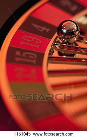 Stock Photography - A stationary roulette wheel with the ball on number 4. Fotosearch