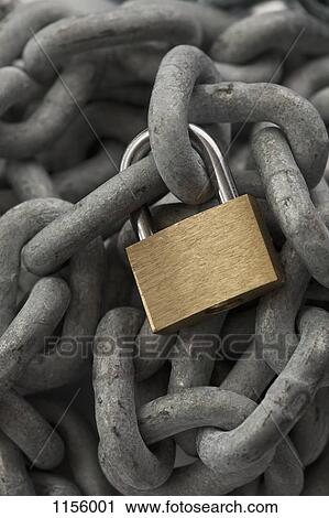 Stock Image - A steel chain with a gold padlock. Fotosearch