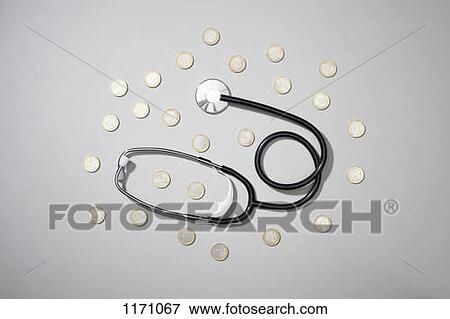 A stethoscope lying amongst Euro coins View Large Photo Image Stock Photo - A stethoscope lying amongst Euro coins. Fotosearch
