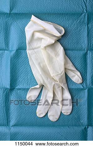 A surgical glove on a surgical drape View Large Photo Image Picture - A surgical glove on a surgical drape. Fotosearch