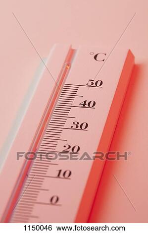 Stock Photograph - A thermometer measuring heat in Celsius. Fotosearch