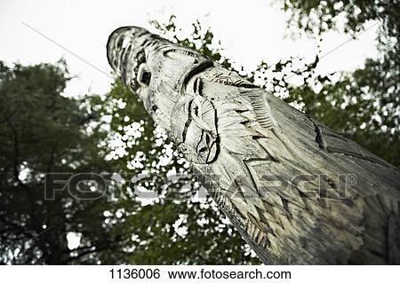 A totem pole in the indigenous Even village Anavgay, Kamchatka, Russia View Large Photo Image Stock Photograph - A totem pole in the indigenous Even village Anavgay, Kamchatka, Russia. Fotosearch
