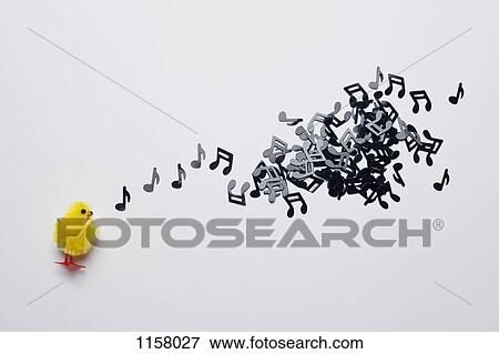 A toy Easter chick next to a group of musical notes View Large Photo Image Stock Photo - A toy Easter chick next to a group of musical notes. Fotosearch