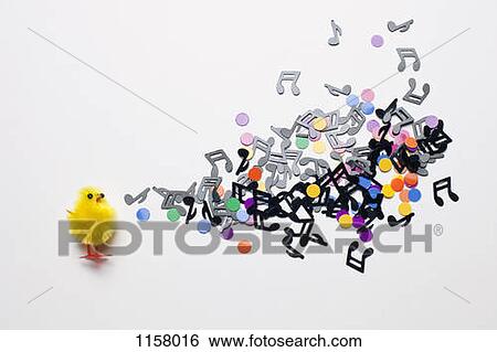 A toy Easter chick next to a group of musical notes and confetti View Large Photo Image Stock Photograph - A toy Easter chick next to a group of musical notes and confetti. Fotosearch