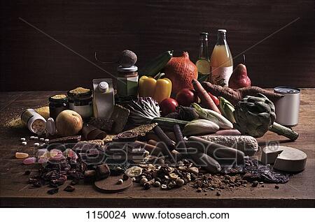 Picture - A variety of fresh and processed foods in a heap on a table. Fotosearch