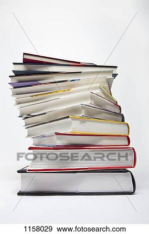 A variety of hardcover books arranged in a spiraling stack View Large Photo Image Stock Photo - A variety of hardcover books arranged in a spiraling stack. Fotosearch