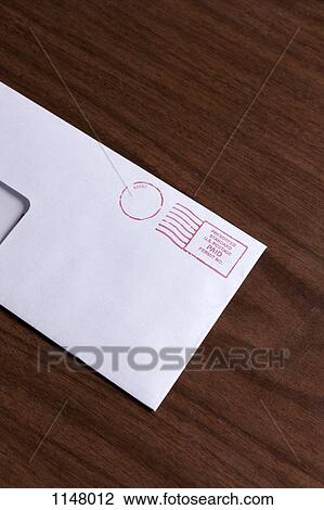 A window envelope with a red ink postage stamp View Large Photo Image Stock Image - A window envelope with a red ink postage stamp. Fotosearch