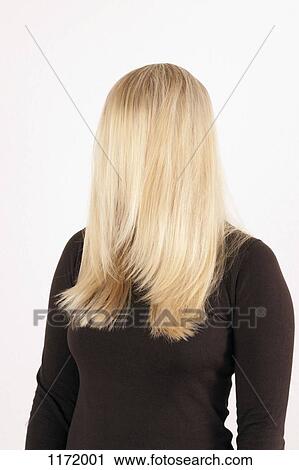 A woman standing with her long, blond hair combed forward covering her face View Large Photo Image Stock Image - A woman standing with her long, blond hair combed forward covering her face. Fotosearch