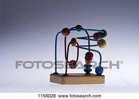 A wooden bead maze children's educational toy View Large Photo Image Stock Photo - A wooden bead maze children's educational toy. Fotosearch