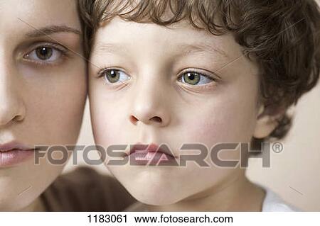 A young boy and his mother cheek to cheek View Large Photo Image Stock Image - A young boy and his mother cheek to cheek. Fotosearch