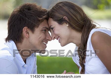 A young couple face to face View Large Photo Image Stock Photograph - A young couple face to face. Fotosearch
