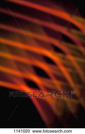 Stock Image - Abstract pattern of crisscrossing orange and red light beams. Fotosearch