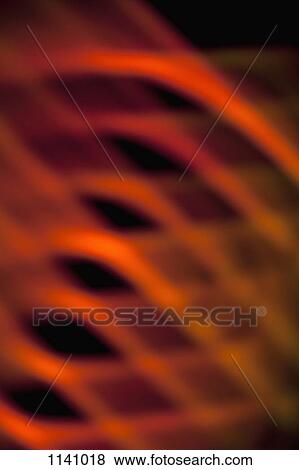 Stock Photo - Abstract pattern of crisscrossing orange and red light beams. Fotosearch