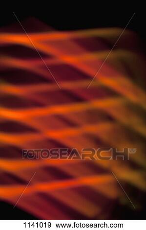 Abstract pattern of crisscrossing orange and red light beams View Large Photo Image Stock Photo - Abstract pattern of crisscrossing orange and red light beams. Fotosearch