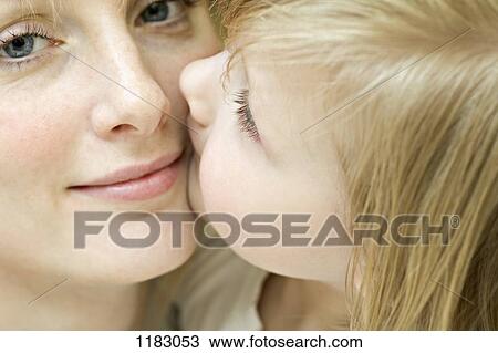 Stock Image - An affectionate mother and daughter, close-up. Fotosearch