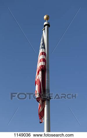 Stock Photograph - An American flag hanging down. Fotosearch