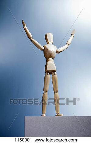 An artist's figure standing atop a box with arms raised and head tilted up View Large Photo Image Stock Image - An artist's figure standing atop a box with arms raised and head tilted up. Fotosearch