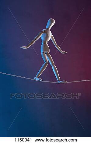 An artist's figure walking a tightrope View Large Photo Image Stock Image - An artist's figure walking a tightrope. Fotosearch